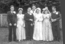 473: Della Norman's wedding. L-r Michael Norman, Elizabeth O'Leary, William O'Leary  (the groom), unidentified priest, Della Norman (the bride), Sarah Norman, and  James O'Leary. (1943) [courtesy of Della (Norman) O'Leary]  - Della, Michael and Sarah children of Thomas Norman &amp;amp; Jane Traverse;  Elizabeth and James O'Leary siblings of the groom